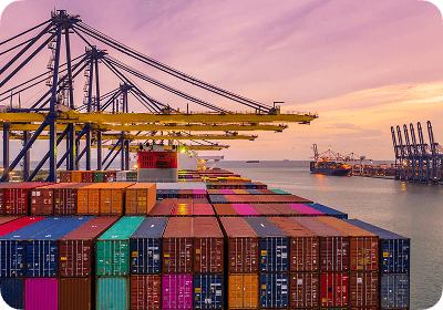 Port cranes and containers during sunset